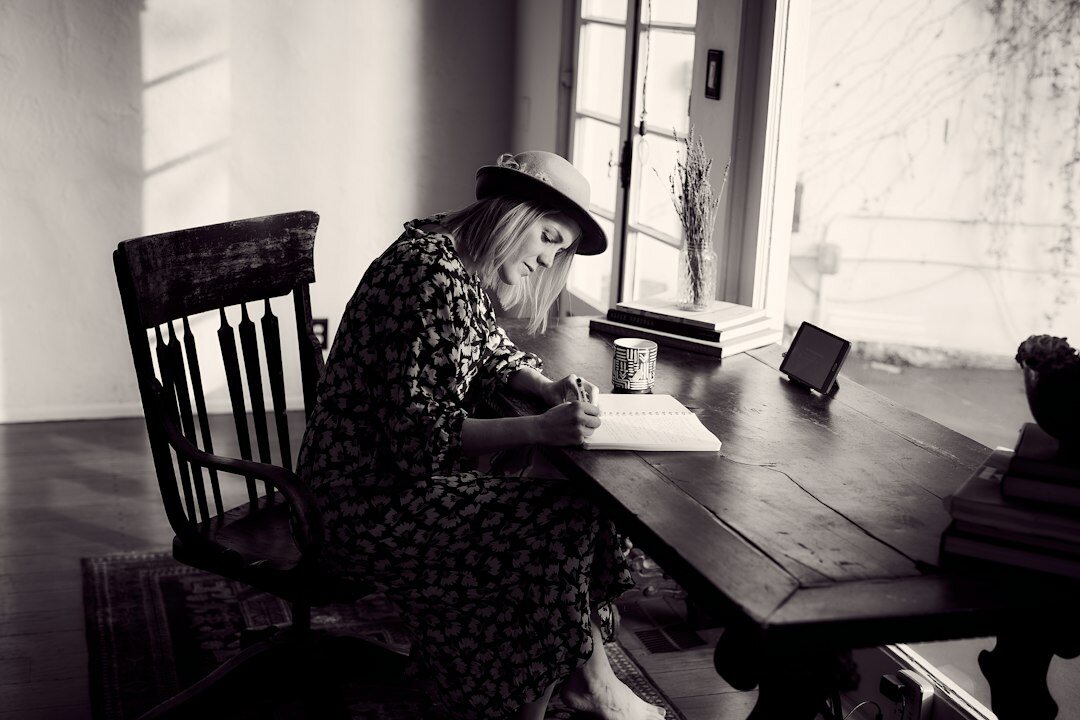 writer at desk thinking
