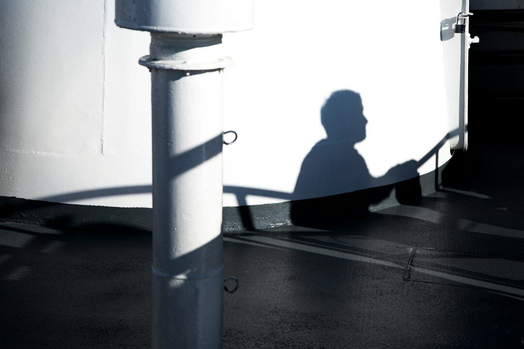 man thinking in shadows